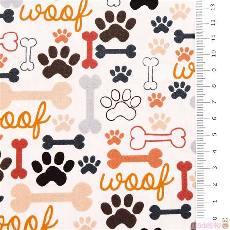 animal fabric from the USA with dog bones, dog paws and word 'Woof' Dog ...