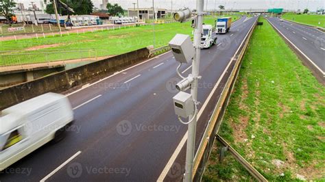 Traffic radar with speed enforcement camera in a highway. 7426158 Stock Photo at Vecteezy