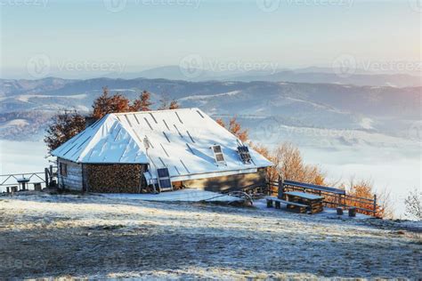 cabin in the mountains in winter. 6627599 Stock Photo at Vecteezy