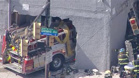 4 firefighters, civilian injured after fire truck crashes through building in North Philadelphia