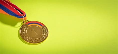 Premium Photo | Medal awards for winner on the green background