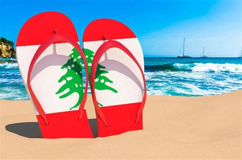 Premium Photo | Flip flops with Libyan flag on the beach Libya resorts ...