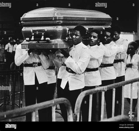 A Jamaican honor guard carries the casket bearing the body of Reggae music star Bob Marley into ...