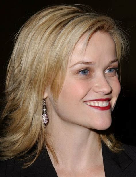 Reese Witherspoon sporting a choppy haircut with ends that flip out