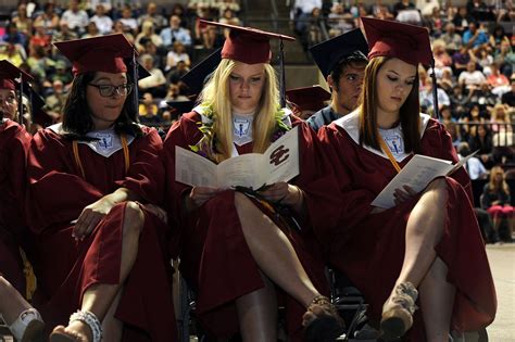 Sand Creek High School graduates listen during a commencement ceremony ...