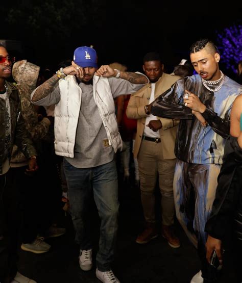 Former foes Drake and Chris Brown play nice at pal's party