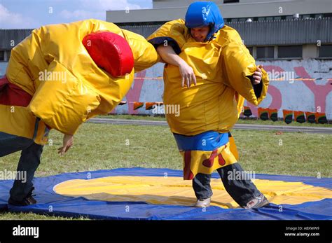 Funny sumo fighting parody in special costumes Stock Photo - Alamy