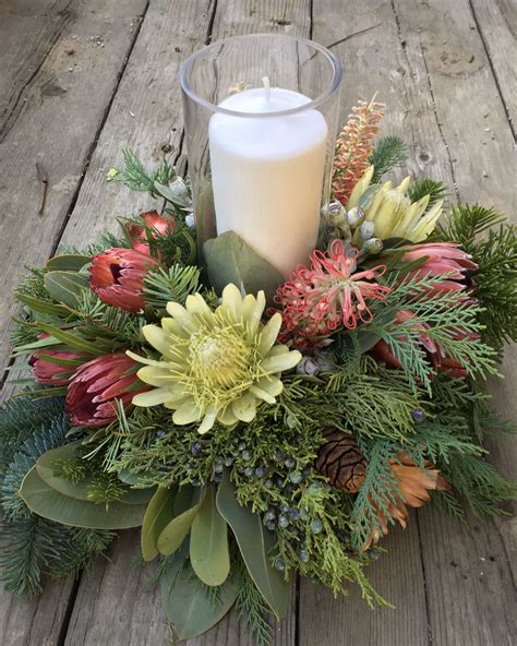 Protea Pillar Candle Centerpiece | Pillar candle centerpieces, Flower arrangements, Candle ...