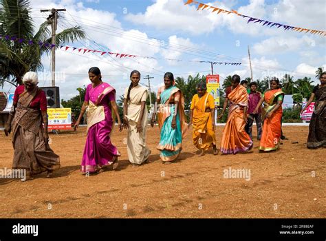 Women clapping hands folk dance called kummi during Pongal celebration ...