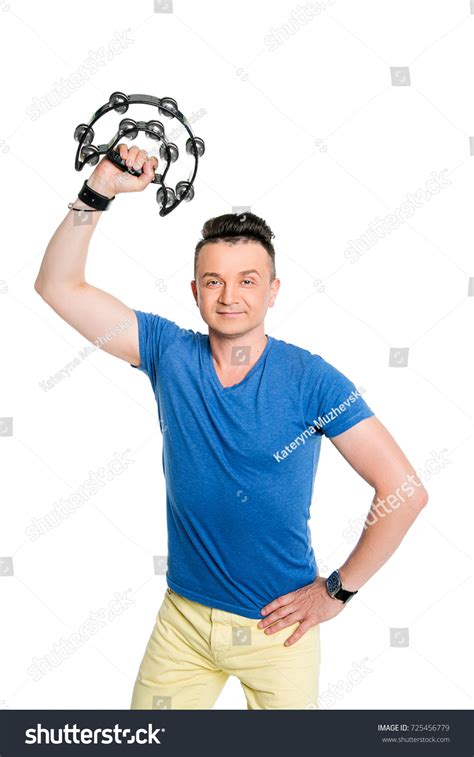 Young Man Playing On Tambourine Stock Photo 725456779 | Shutterstock