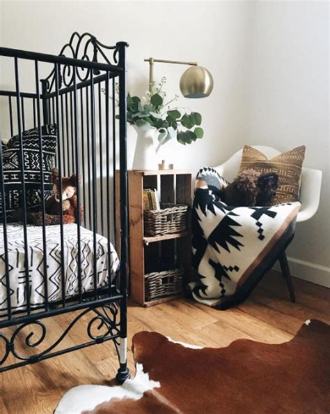 Love this chic nursery with southwestern notes. The black iron crib is simple and drop dead ...