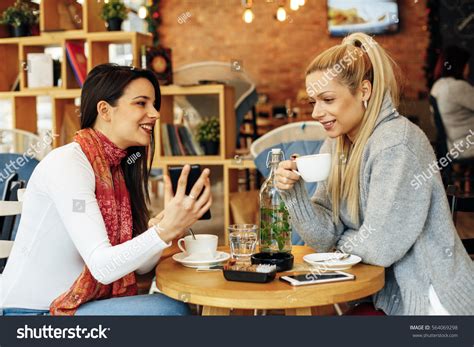 Two Women Drinking Coffee Cafe Talking Stock Photo 564069298 | Shutterstock