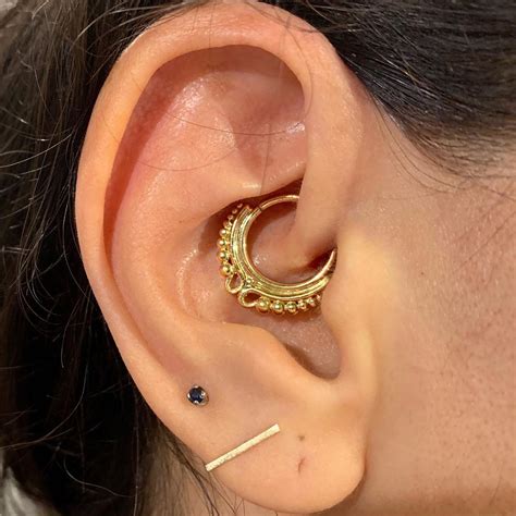 25 Subtle Inner-Ear Piercings That Are Dazzling Surprises