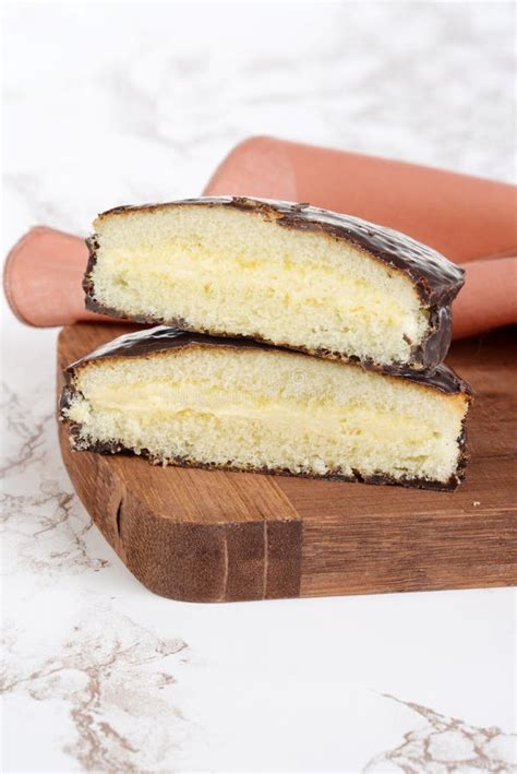 Slices of Custard Cream Filled Chocolate Sponge Cake Stock Image - Image of board, baked: 164094925