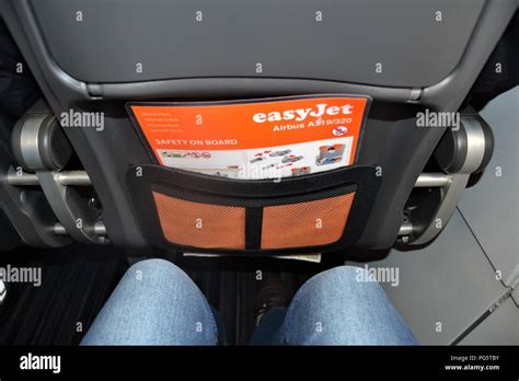 In-flight legroom seat pitch backseat view Stock Photo - Alamy