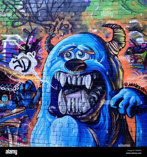 Street Art scary monster graffiti lane Stock Photo - Alamy