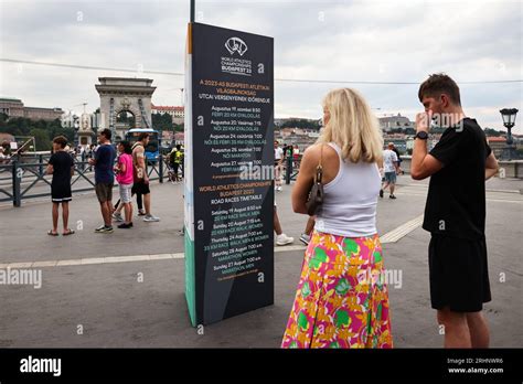 Budapest. 17th Aug, 2023. People look at an information board of the ...