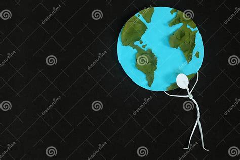 Human Stick Figure Man Carrying the Earth on His Shoulders on Dark Black Background. Save Planet ...