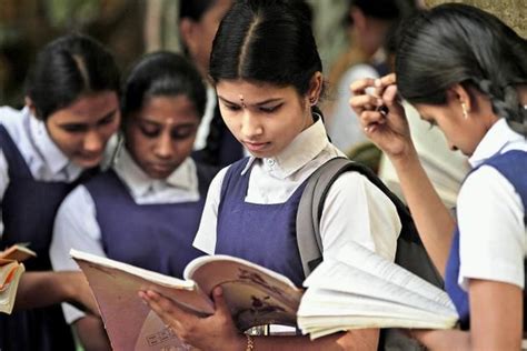 This picture shows girls in India trying to read. Women’s education in India is not good. Many ...