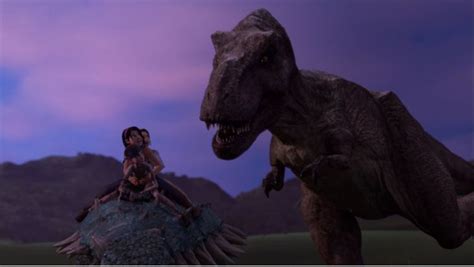 a woman sitting on top of a dinosaur next to a man in front of a mountain