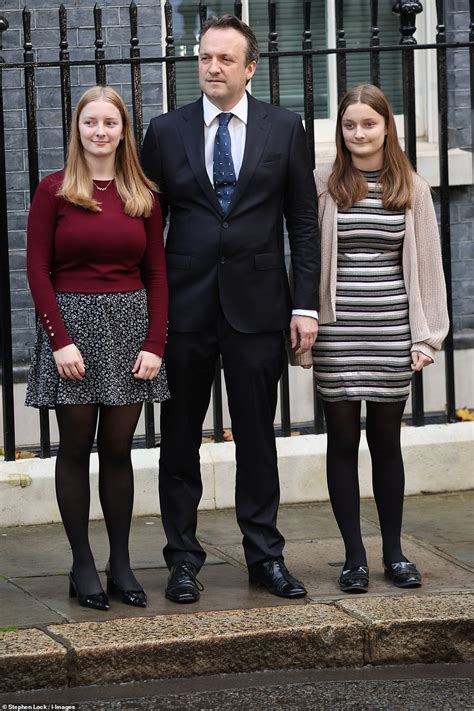 Liz Truss's final moments in power: Smiling outgoing PM is joined by husband and daughters ...