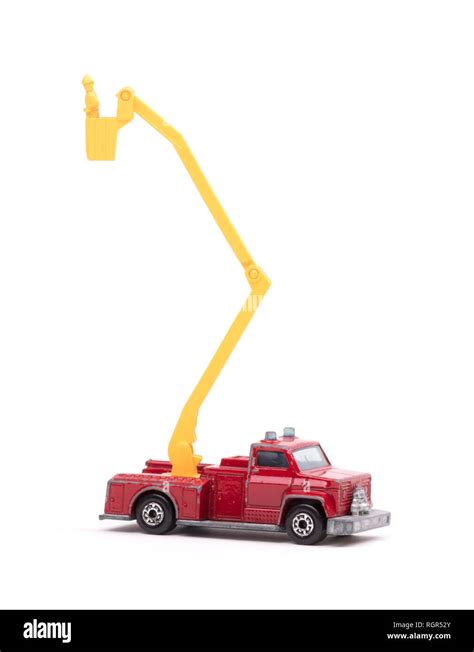 Toy firetruck with ladder extended on white background Stock Photo - Alamy