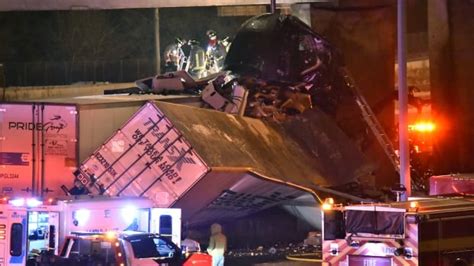 Transport truck crash on Highway 401 leaves driver trapped nearly 2 storeys up | CBC News