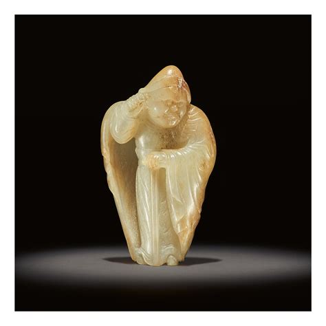 AN EXCEEDINGLY RARE WHITE AND RUSSET JADE CARVING OF A FOREIGNER, TANG ...