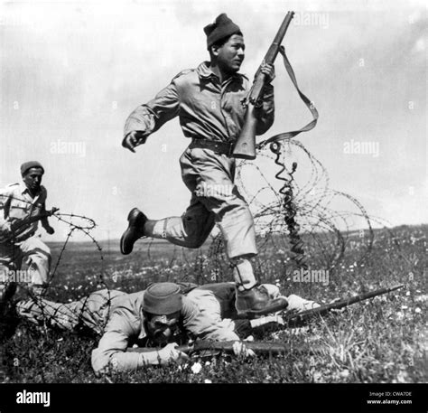 TEL AVIV, PALESTINE, 1948: Israeli Haganah fighter dashes across a ...