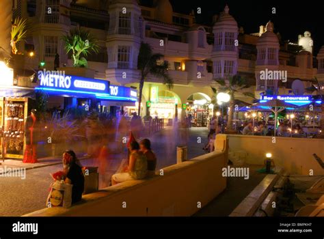 Bars and restaurants in the marina area at night, Benalmadena Costa ...