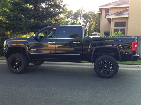 GMC Sierra black lifted truck | Lifted GMC Sierra Trucks Jacked GMC ...