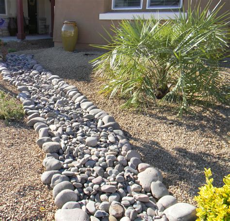 Apache Brown Rock Gravel 5/8" with Arizona River Rock. Very good contrasting textures with ...