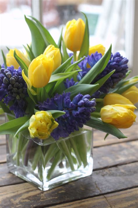 yellow tulip blue hyacinth spring flowers | Tulips arrangement, Flower arrangements center ...