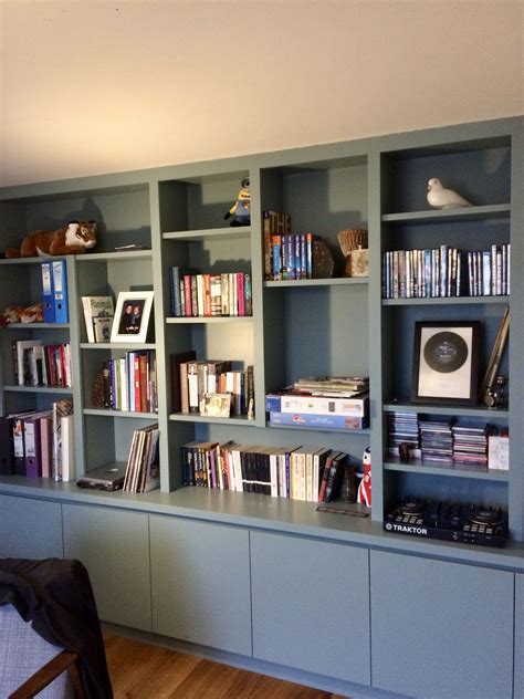 Smart stylish contemporary bookcase providing plenty of library shelving and hidd… | Shelving ...