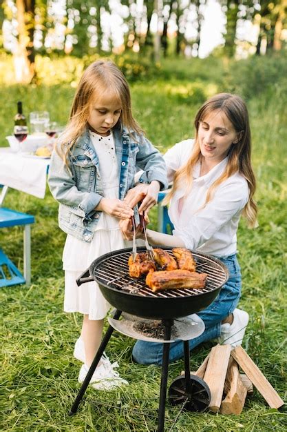 Free Photo | Family doing a barbecue in nature