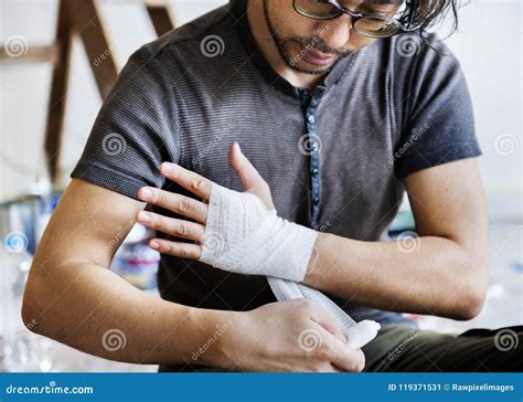 Man Wrapping Injured Hand with Bandage Stock Image - Image of japanese, hand: 119371531