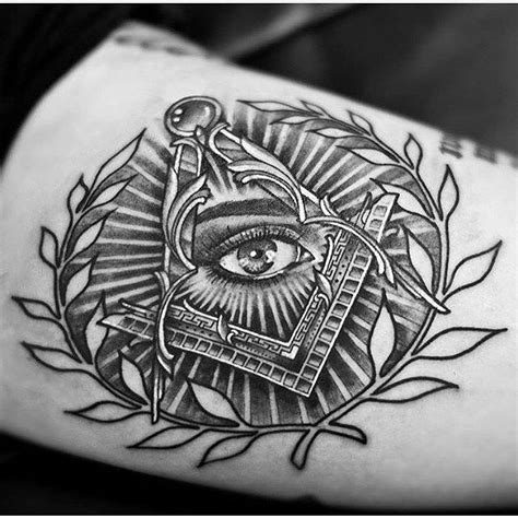 a black and white tattoo with an all seeing eye