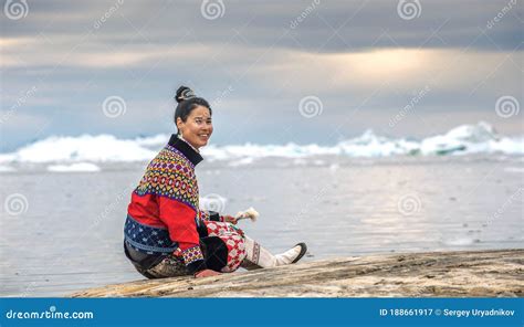 Young Inuit Woman in Traditional Clothing Posing for Photos on the ...