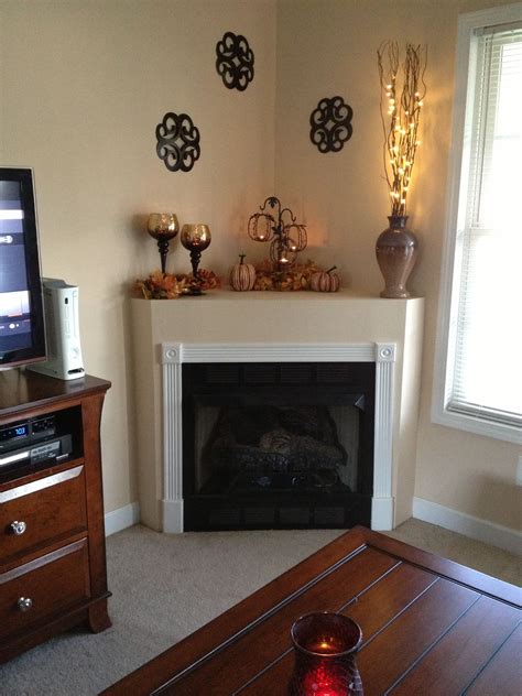 Corner fireplace mantle fall decor | Corner fireplace decor, Corner mantle decor, Living room ...