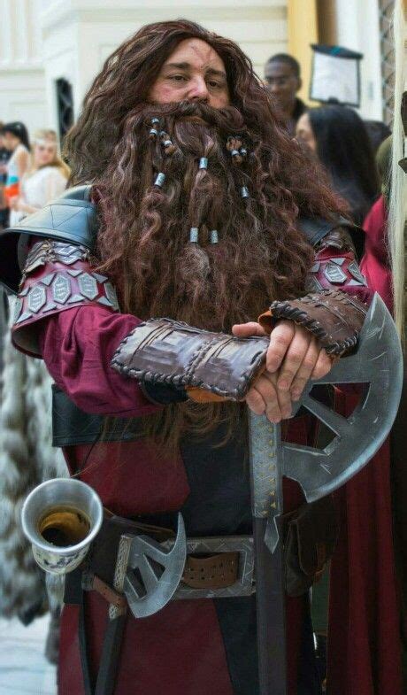 a man with long hair and beard dressed in costume