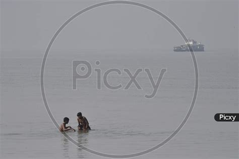 Image of Young Indian Boys Swimming In River Bramaputra In Assam-AN734419-Picxy