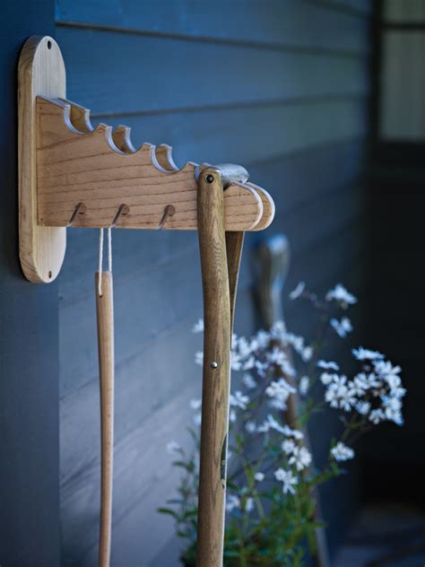 Garden Tool Hanger - I like the idea of this, only notch pieces of wood ...