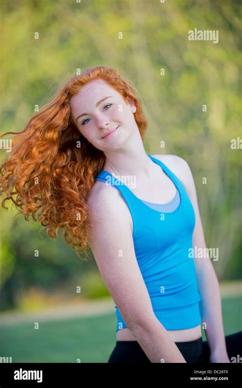 Portrait of teenage girl with long red hair Stock Photo - Alamy