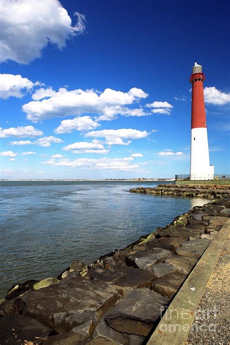 The Lighthouse at Long Beach Island Photograph by John Rizzuto