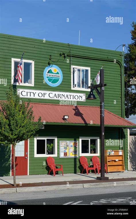 Carnation, WA, USA - October 8, 2023; City of Carnation green wooden office building in downtown ...