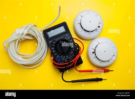 Installation of a new fire alarm system, smart home Stock Photo - Alamy