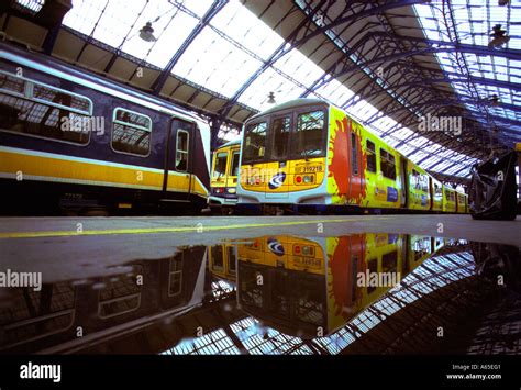 Thameslink Brighton to Bedford train left stands next to an outgoing Connex South Central train ...