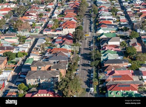 Aerial view of urban suburb residential area with houses and street. Drone view from above ...