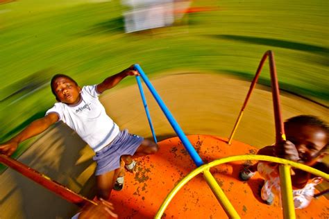 Children playing on a Merry Go Round | Kids playing, Family photography, Merry go round