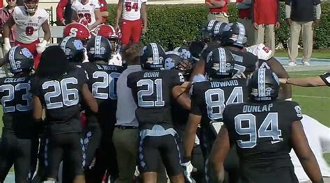 UNC, NC State fight after weird fumble (video) - Sports Illustrated